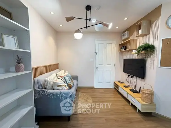 Charming living room with modern decor, cozy sofa, and stylish shelving in a bright, inviting space.