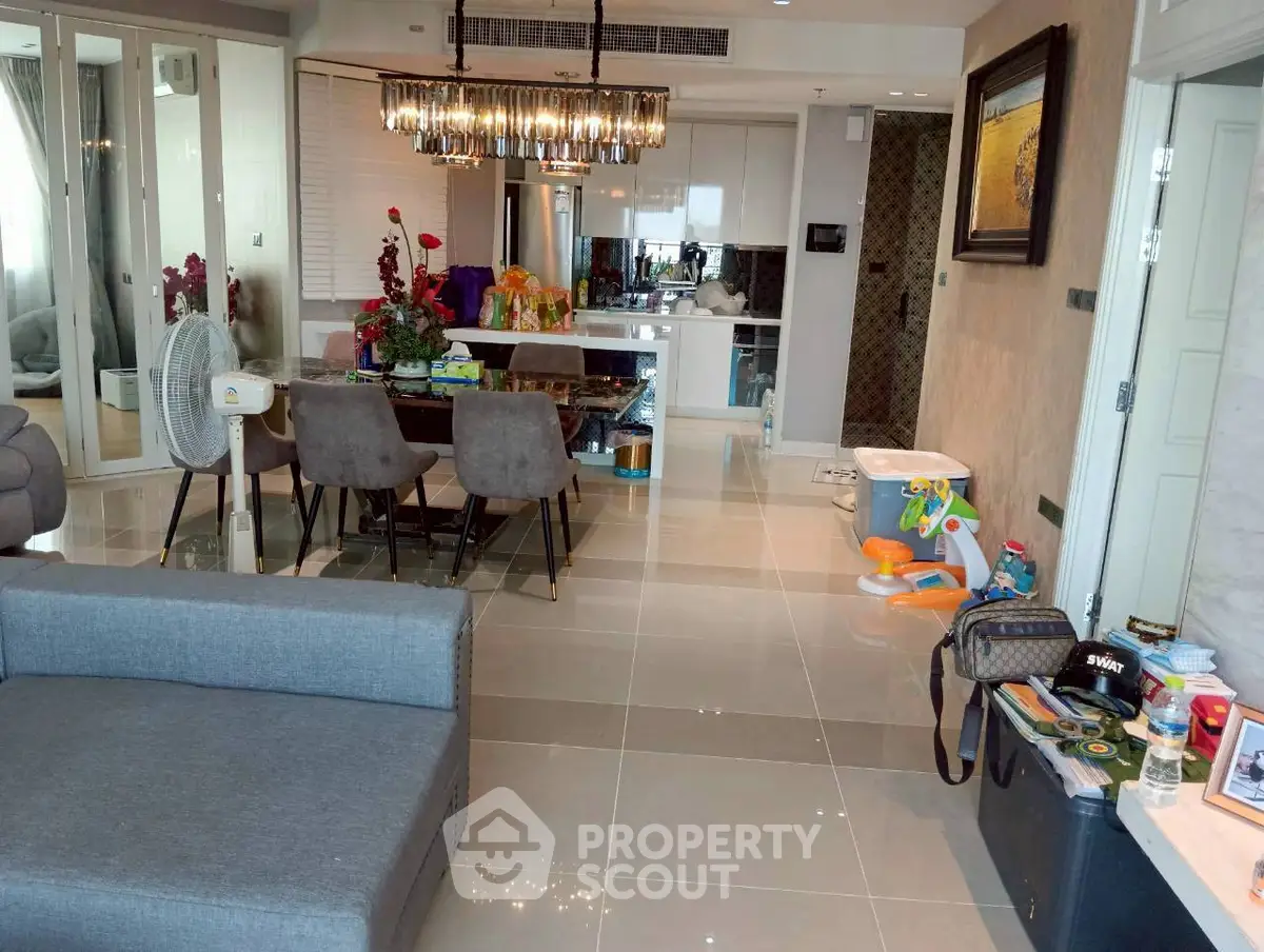 Modern open-plan living and dining area with stylish decor and contemporary furniture.