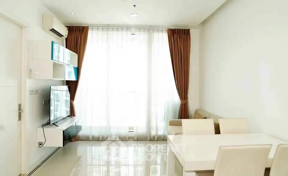 Bright modern living room with sleek furniture and large window in a stylish apartment.