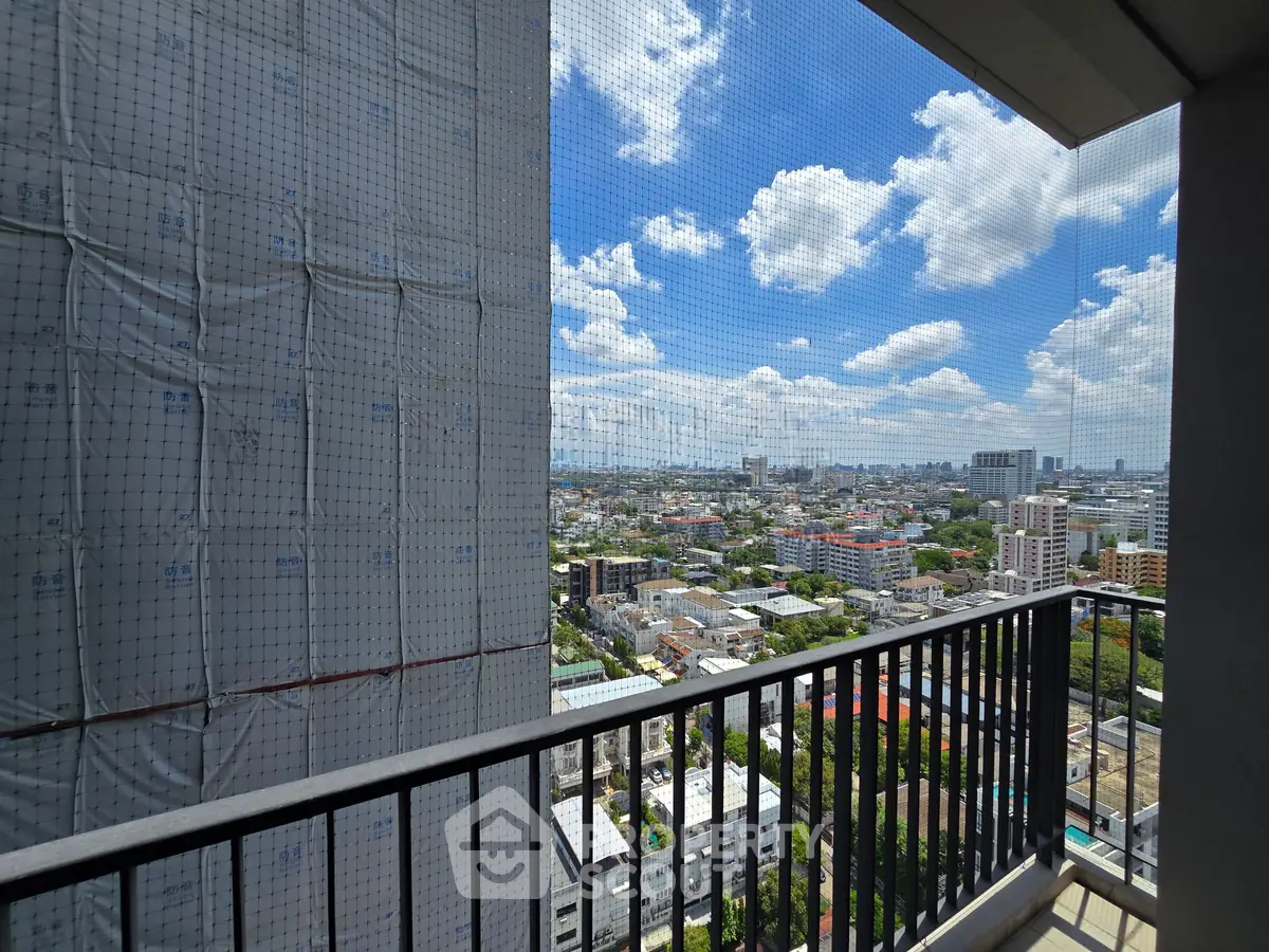 Stunning cityscape view from a high-rise balcony, perfect for urban living enthusiasts.