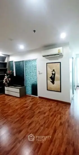 Modern living room with wooden flooring and stylish decor