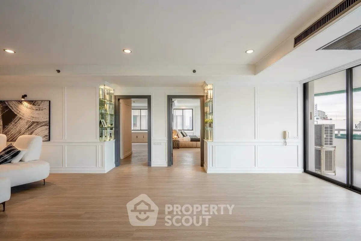 Spacious modern living room with elegant decor and large windows