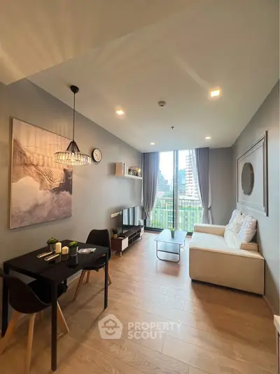 Modern living room with stylish decor and city view from large windows