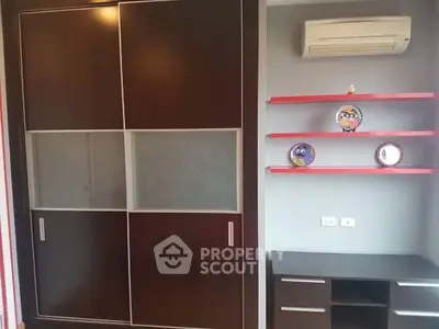 Modern study room with sleek dark wood furniture and air conditioning