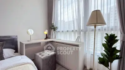 Bright bedroom with large windows and modern decor in urban apartment