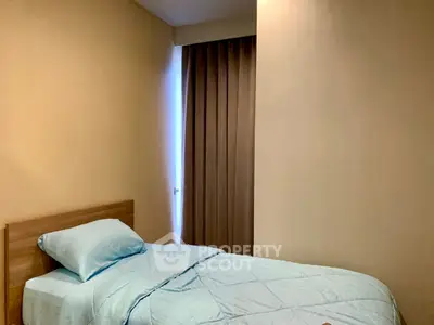 Cozy single bedroom with soft lighting and minimalist decor