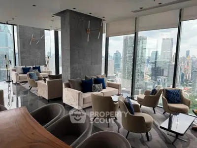 Luxurious high-rise living room with panoramic city views and modern furnishings.