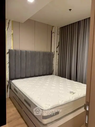 Luxurious bedroom with elegant design and plush mattress in modern apartment.