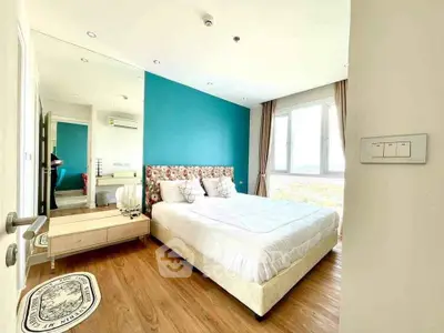 Bright and spacious bedroom with modern decor and large window view