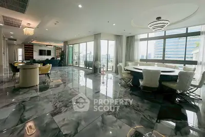 Luxurious open-plan living room with panoramic city views and elegant marble flooring.