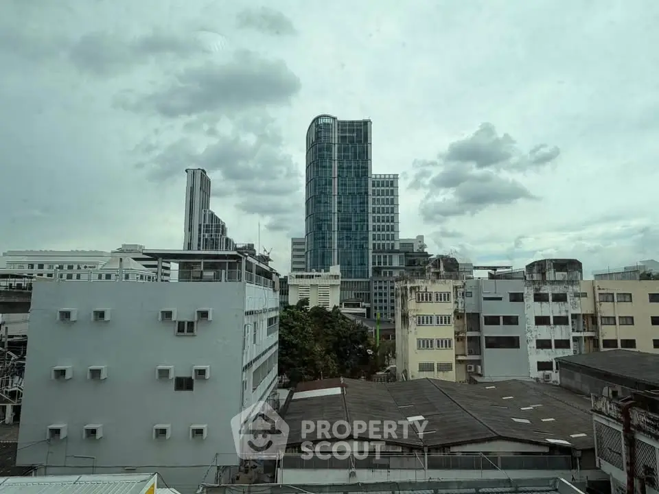 Urban skyline view with modern high-rise buildings and cloudy sky