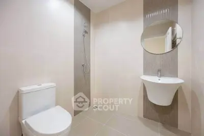 Modern minimalist bathroom with sleek fixtures and neutral tiles