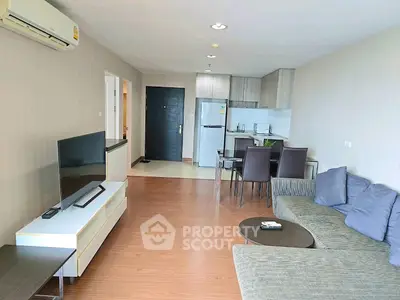 Spacious modern living room with open kitchen and stylish furniture