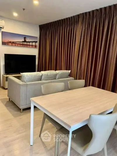 Modern living room with elegant curtains and cozy seating area