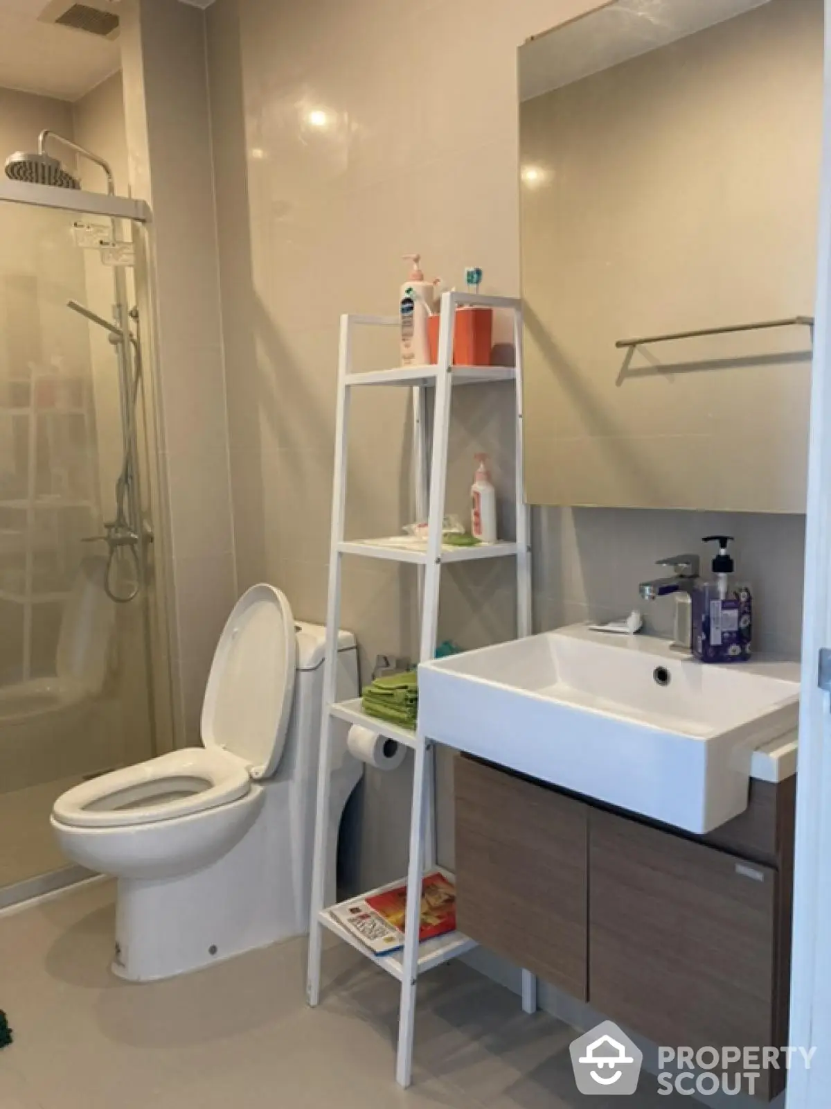 Modern bathroom with sleek fixtures and spacious shower area