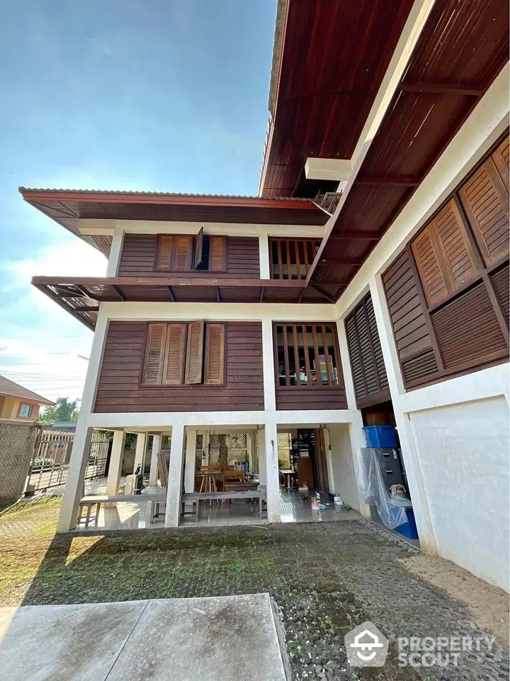 Charming traditional wooden house with spacious outdoor area and modern amenities.