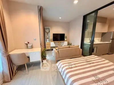Modern studio apartment with cozy living area and stylish kitchen