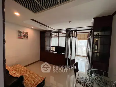 Spacious living room with modern decor and ample natural light