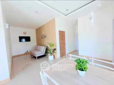 Bright and modern living room with cozy sofa and stylish decor
