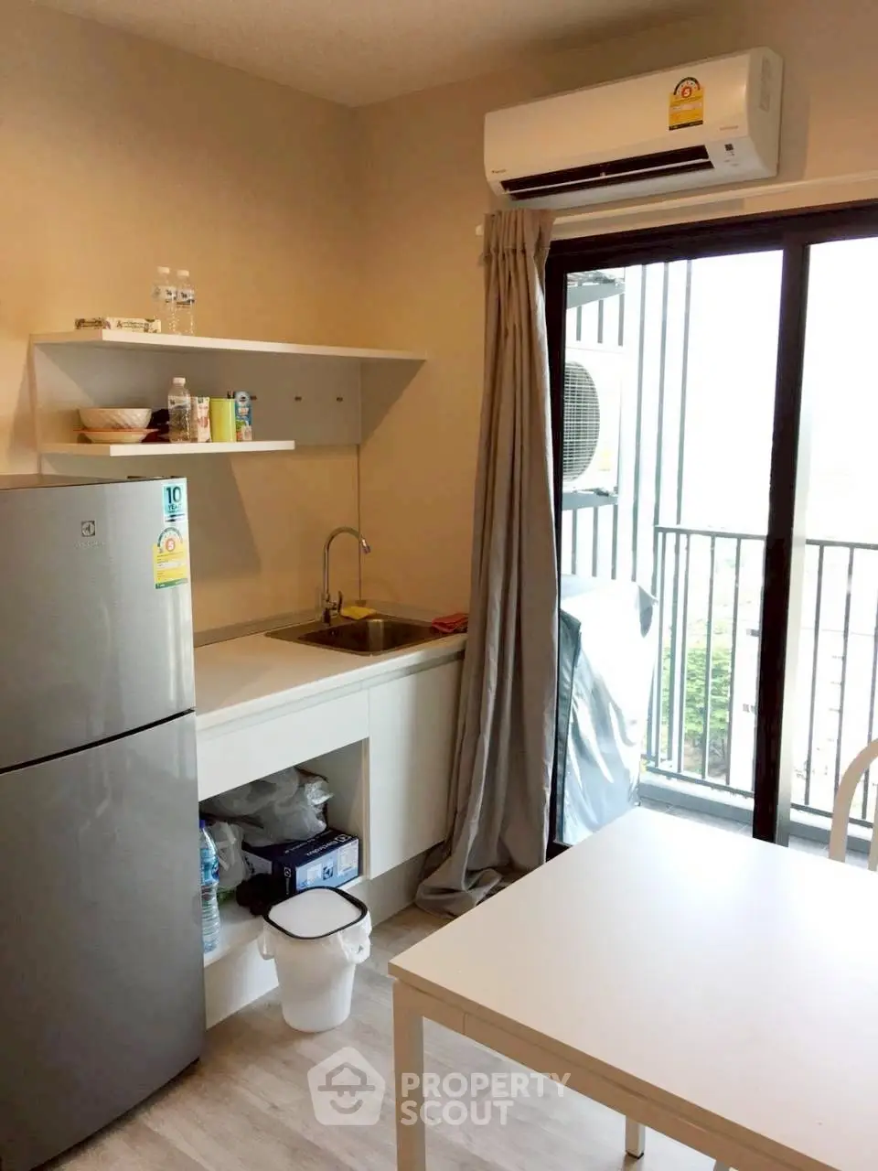 Cozy kitchen with modern appliances and balcony view