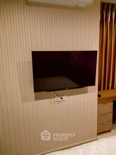 Modern living room with wall-mounted TV and elegant decor