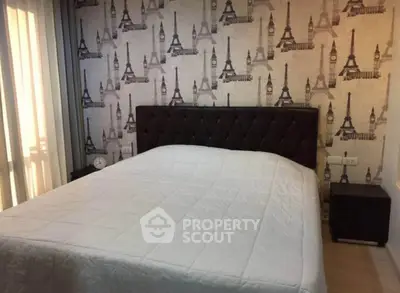 Chic bedroom with Eiffel Tower wallpaper and elegant headboard