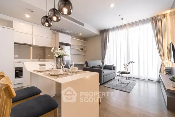 Modern open-plan living room with stylish kitchen and elegant decor