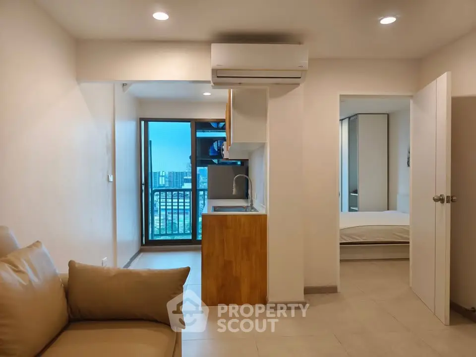 Modern apartment interior with open layout and city view balcony