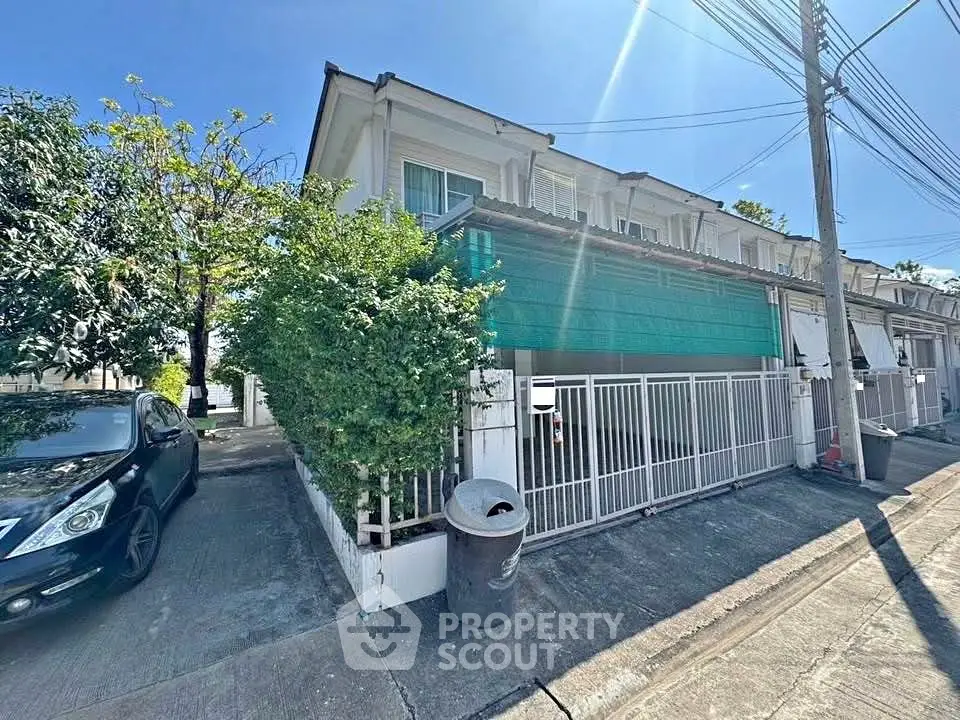 Charming corner townhouse with lush greenery and ample parking space