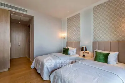 Elegant bedroom with twin beds and stylish decor in modern apartment