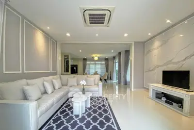 Luxurious living room with elegant decor and modern furnishings, featuring a spacious layout and stylish accents.