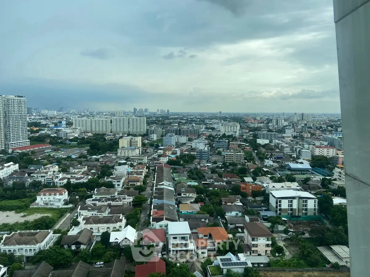 Stunning cityscape view from high-rise building showcasing urban living and skyline.
