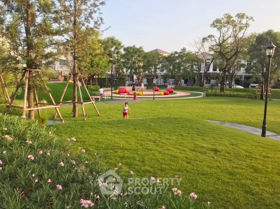 Spacious green garden with modern landscaping in a residential community.