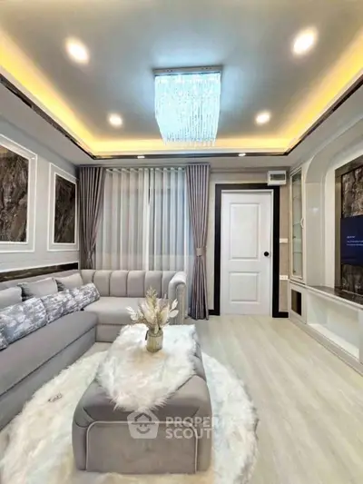 Luxurious living room with elegant decor and modern lighting