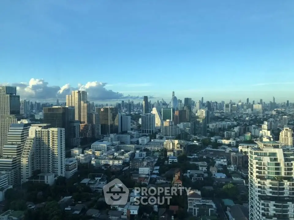 Stunning cityscape view from a high-rise building showcasing a vibrant urban skyline.