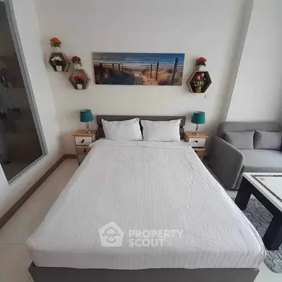 Cozy bedroom with modern decor and comfortable bed in a stylish apartment.