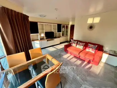 Spacious living room with modern decor and ample natural light