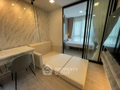 Modern living room with sliding glass doors and cozy furniture