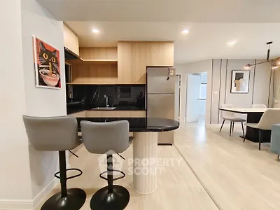 Modern open kitchen with sleek design and stylish bar stools