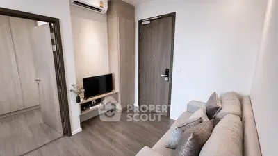 Modern living room with sleek design and cozy sofa in a stylish apartment.