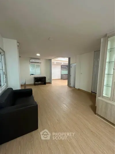 Spacious living room with modern design and wooden flooring
