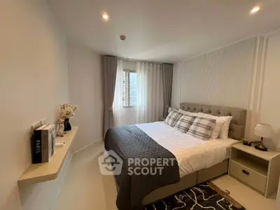 Elegant bedroom with modern decor and cozy ambiance in a stylish apartment.