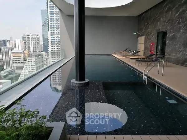 Luxurious rooftop pool with stunning city views in modern high-rise building.