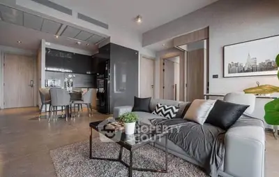 Modern living room with open kitchen and stylish decor