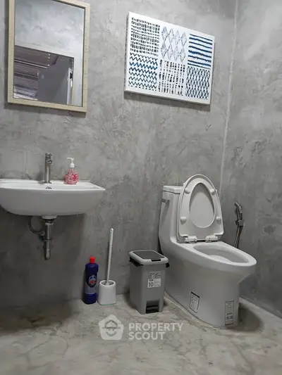 Modern minimalist bathroom with concrete walls and stylish decor