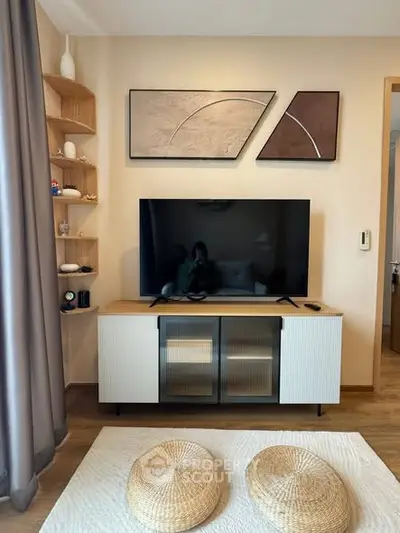 Modern living room with stylish decor and large TV setup