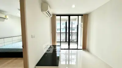 Modern apartment interior with balcony view and air conditioning