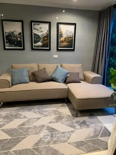 Stylish living room with modern sofa and mountain artwork