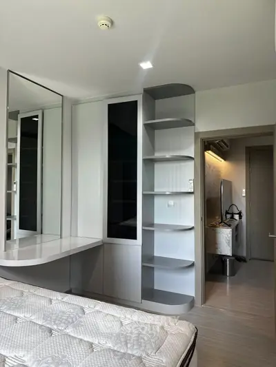 Modern bedroom with sleek built-in storage and stylish decor
