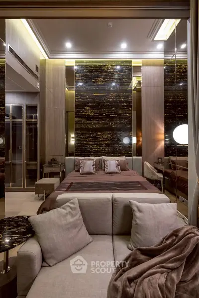Luxurious bedroom with elegant decor and plush furnishings in modern apartment.